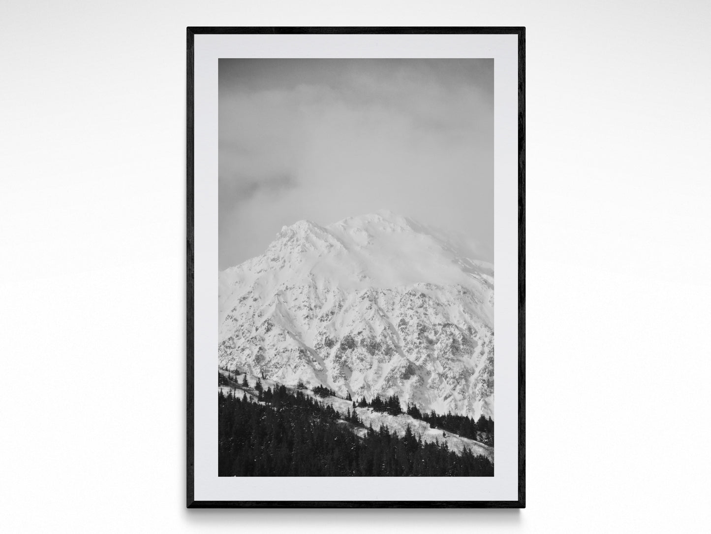 Black and white fine art print of snow-covered mountains, showcasing 'Winter Wonderland' photography by Jessica Joy.