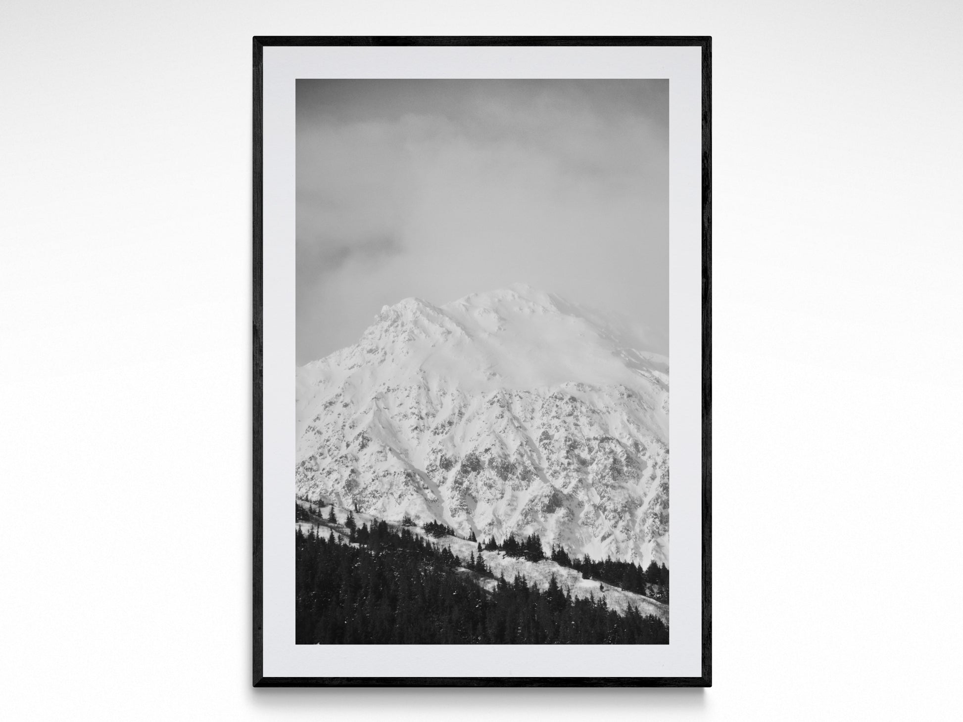 Black and white fine art print of snow-covered mountains, showcasing 'Winter Wonderland' photography by Jessica Joy.