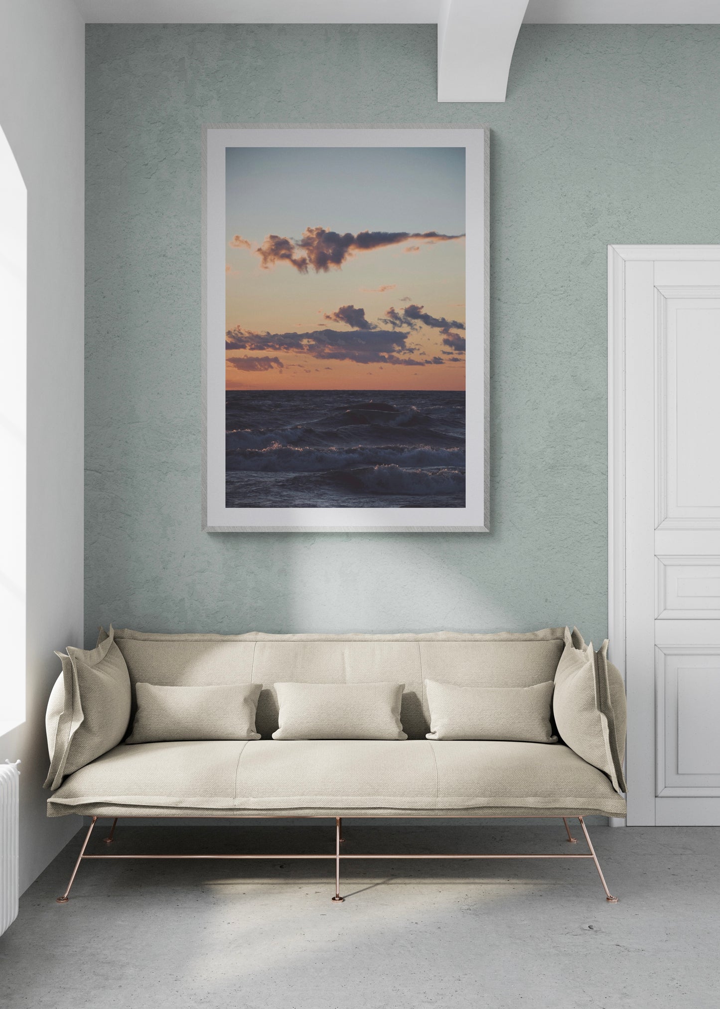 Framed fine art photograph of Lake Michigan sunset, displayed in a modern living room setting.