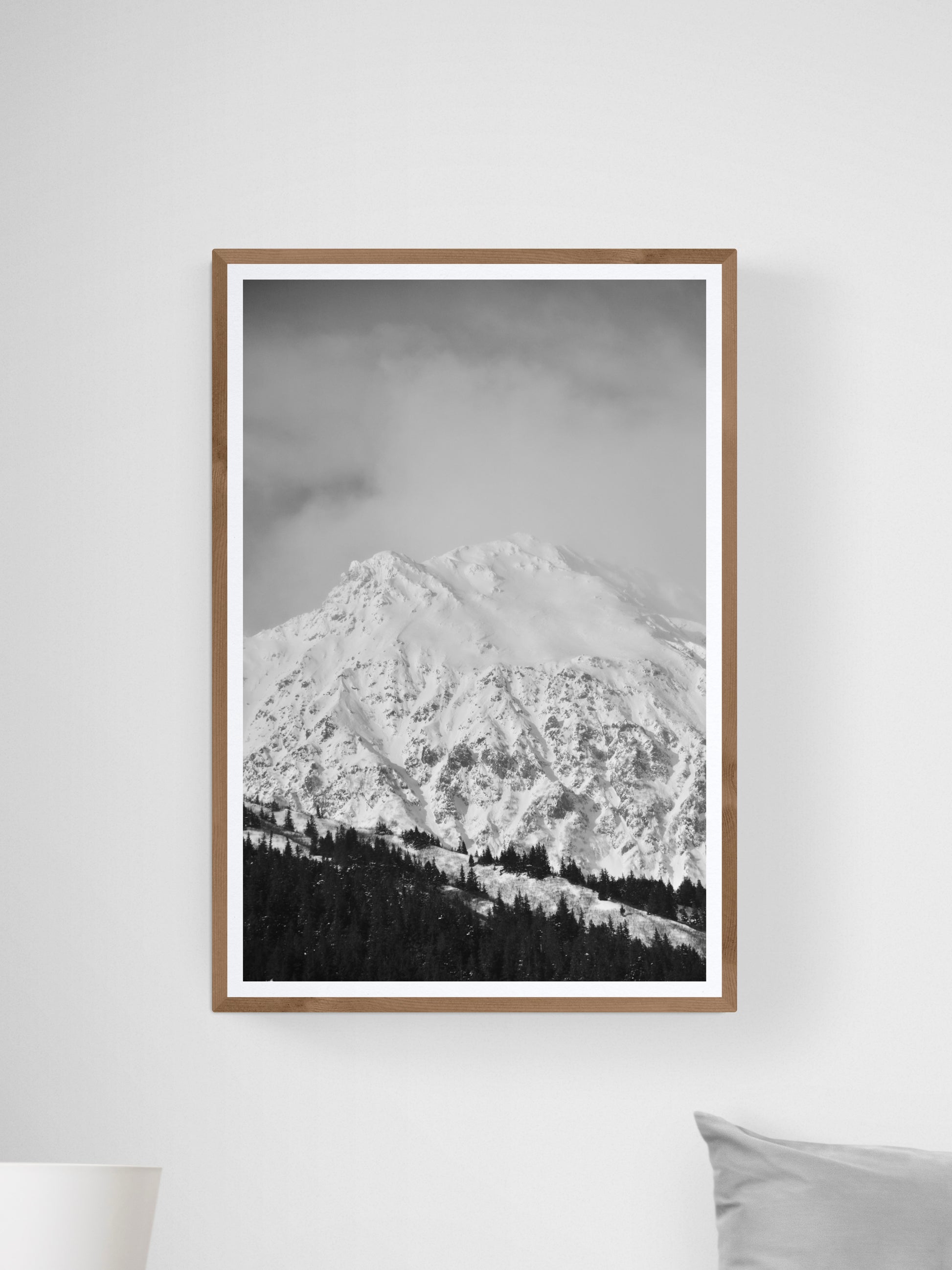 Black and white fine art photography print of a snow-covered mountain in Alaska by Jessica Joy, showcasing winter wonderland.