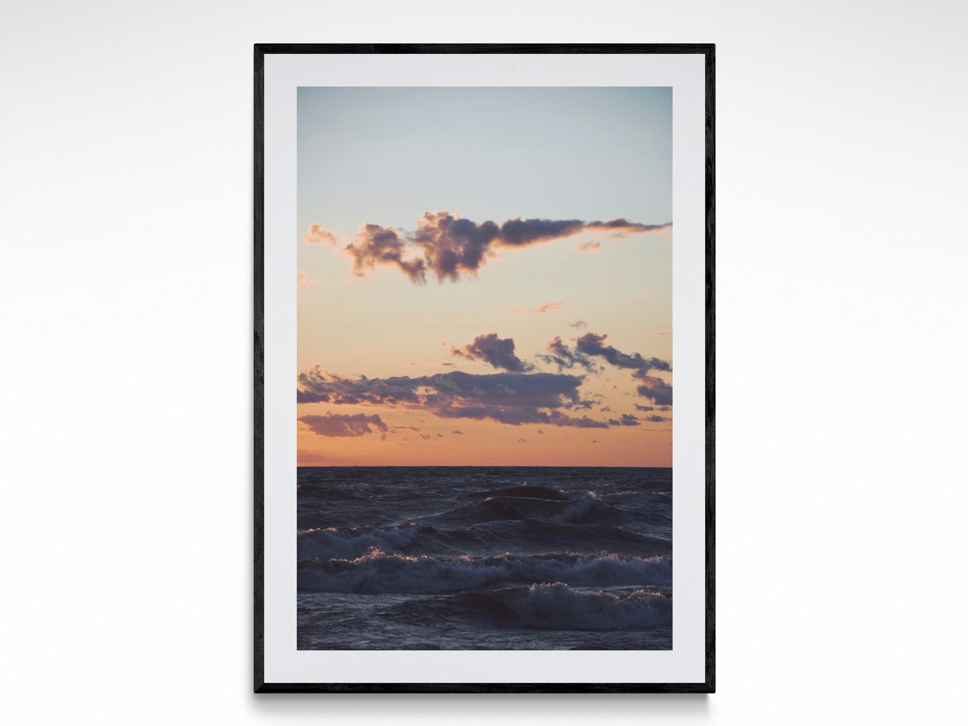 Fine art photography print of Lake Michigan at sunset, featuring waves and vibrant cloud formations.